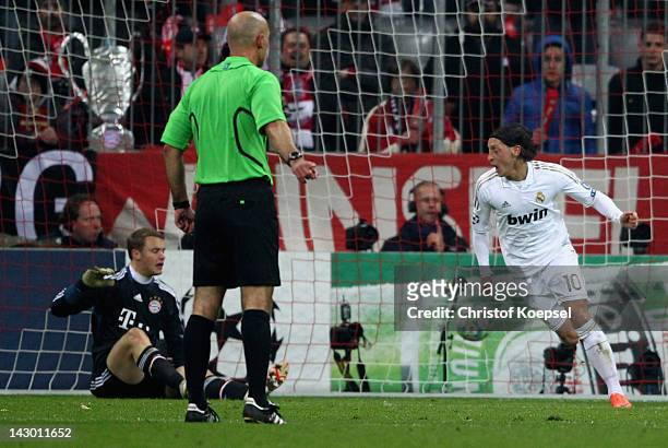 Mesut Oezil of Real Madrid celebrates the first goal against Manuel Neuer of Bayern during the UEFA Champions League Semi Final first leg match...