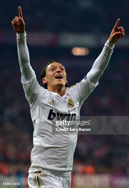 Mesut Oezil of Madrid celebrates after scoring his teams first goal during the UEFA Champoins League Semi Final first leg match between FC Bayern...