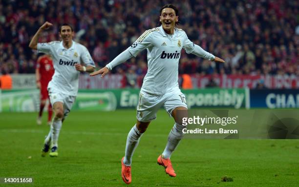 Mesut Oezil of Madrid celebrates after scoring his teams first goal during the UEFA Champoins League Semi Final first leg match between FC Bayern...