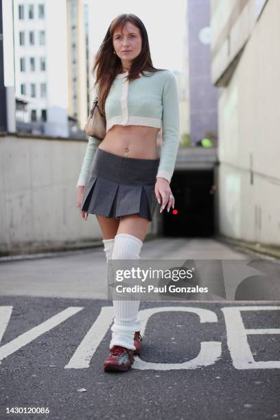 Guest is seen wearing a Pair of Leg Warmers, at FEBEN during London Fashion Week September 2022 on September 17, 2022 in London, England.