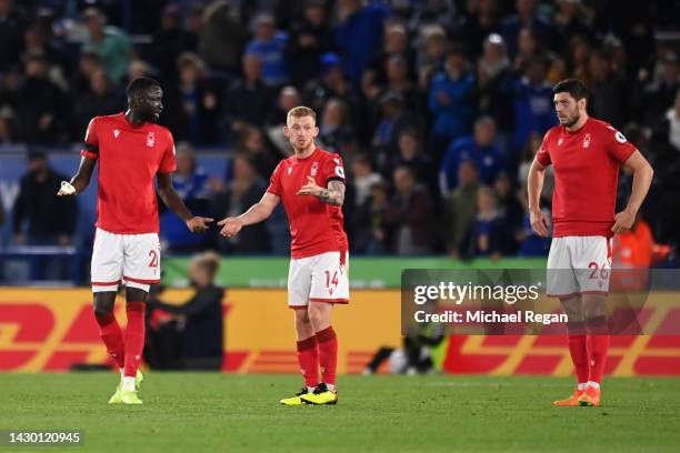 Lewis O’Brien, Cheikhou Kouyate and Scott McKenna of Nottingham Forest react after the Leicester City third goal during the Premier League match...