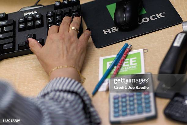 Moraiba Mata a tax professional at H&R Block inputs clients tax information on April 17, 2012 in Miami, Florida. Today is the last day to file taxes...