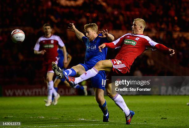 Doncaster player Adam Lockwood challenges Boro forward Curtis Main during the npower Championship match between Middlesbrough and Doncaster Rovers at...