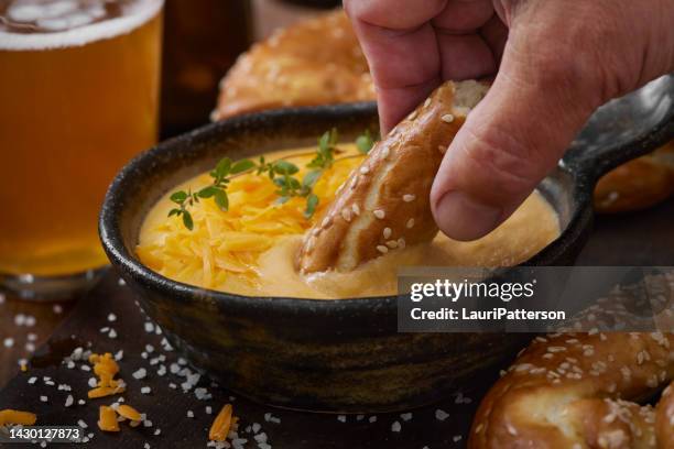 beer cheese sauce with soft pretzels - dipping stock pictures, royalty-free photos & images