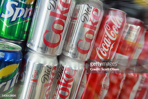 Cans of Sprite, Diet Coke and Coca-Cola are offered for sale at a grocery store on April 17, 2012 in Chicago, Illinois. The Coca-Cola Co. Reported an...