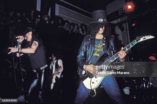 Axl Rose, Izzy Stradlin and Slash of Guns N' Roses perform an acoustic set at The Limelight on January 31, 1988 in New York City.