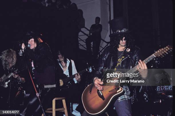 Axl Rose, Izzy Stradlin and Slash of Guns N' Roses perform an acoustic set at The Limelight on January 31, 1988 in New York City.