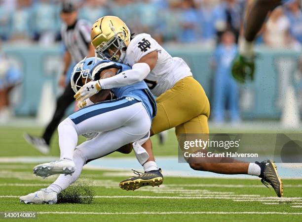 Xavier Watts of the Notre Dame Fighting Irish makes a tackle against the North Carolina Tar Heels during their game at Kenan Memorial Stadium on...
