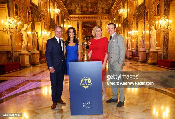Luke Donald, Diane Donald, Kim Barclay and Zach Johnson pose for a photograph with the Ryder Cup Trophy during the Ryder Cup 2023 Year to Go Gala at...