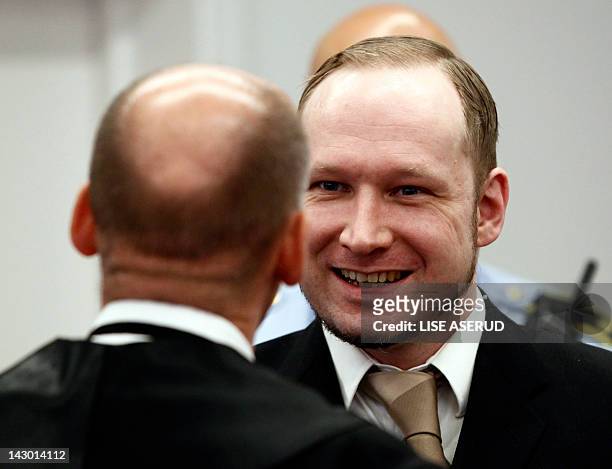 Right-wing extremist Anders Behring Breivik speaks with his lawyer Geir Lippestad in room 250 of the central court in Oslo on April 17 during the...