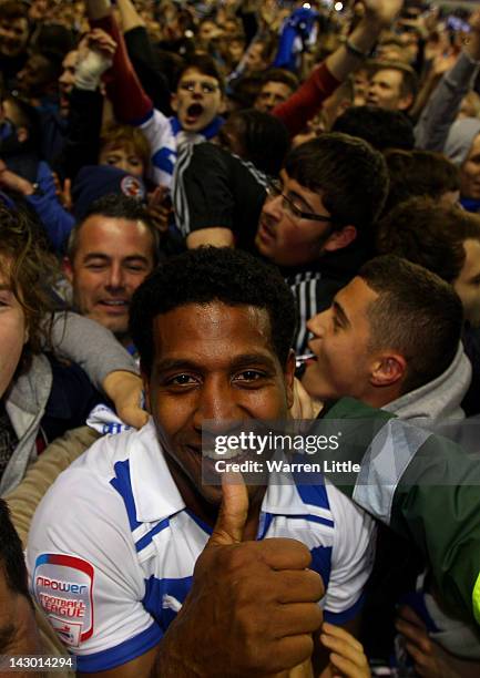 Goal scorer, Mikele Leigertwood of Reading gives a thumbs up as he is congratulated by the fans after winning the npower Championship match between...