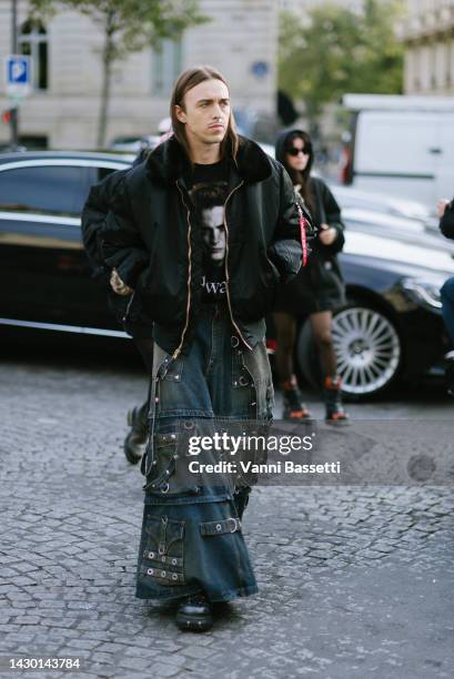 Tommy Cash poses wearing a black bomber jacket and a Balenciaga studded denim maxi skirt after the Yeezy Season 9 show during Paris Fashion Week -...