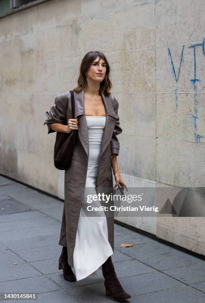 Jeanne Damas wears leather coat, white pants outside Stella McCartney during Paris Fashion Week - Womenswear Spring/Summer 2023 : Day Eight on...