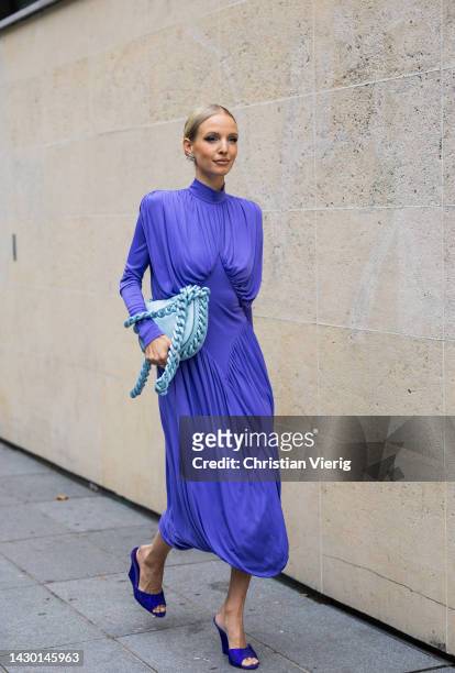 Leonie Hanne wears blue dress, turquoise bag, heels outside Stella McCartney during Paris Fashion Week - Womenswear Spring/Summer 2023 : Day Eight on...