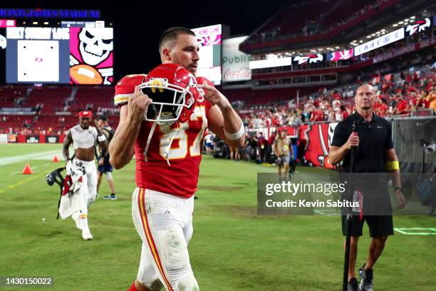 Travis Kelce of the Kansas City Chiefs points to the Chiefs logo on his helmet after an NFL football game against the Tampa Bay Buccaneers at Raymond...