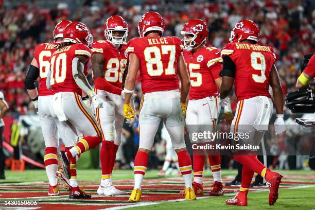 Jody Fortson of the Kansas City Chiefs celebrates with JuJu Smith-Schuster, Patrick Mahomes, Isiah Pacheco, Joe Thuney, and Travis Kelce after...
