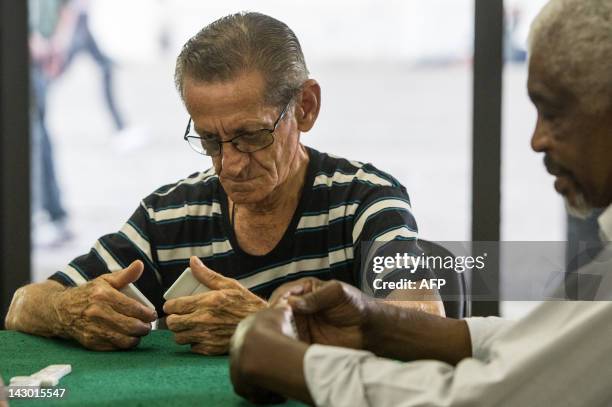 An eldery man plays Dominoes at Centro de Referencia da Cidadania do Idoso in downtown Sao Paulo, Brazil on April 11, 2012. More than 20 workshops...