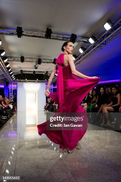 Model walks the runway during the Ariella Couture fashion show at 250 Bishopsgate on April 17, 2012 in London, England.