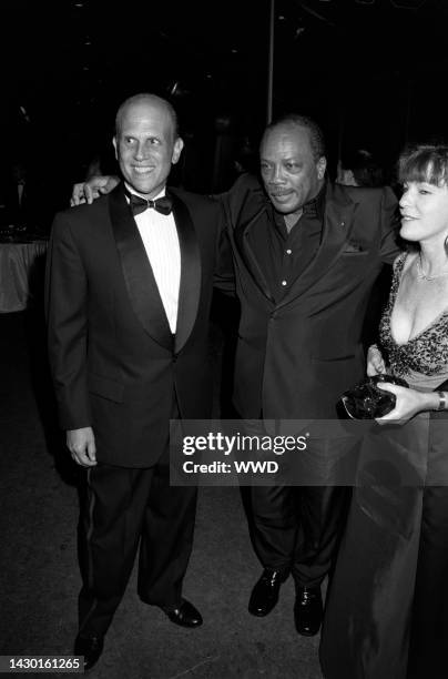 Michael Milken, Quincy Jones, and Lori Anne Hankel attend the Fire and Ice Ball, benefiting the Revlon/UCLA Women's Cancer Research Program, at the...