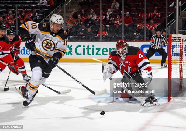 Greer of the Boston Bruins is stopped by Vitek Vanecek of the New Jersey Devils during the first period at the Prudential Center on October 03, 2022...