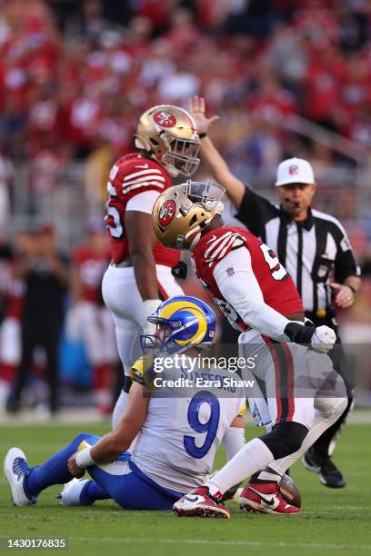 Defensive end Samson Ebukam of the San Francisco 49ers celebrates a sack on quarterback Matthew Stafford of the Los Angeles Rams during the first...