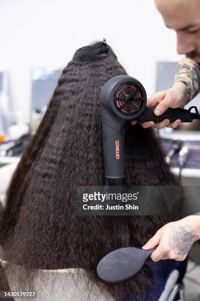 Model gets hair and make-up done in the backstage prior to the Germanier Womenswear Spring/Summer 2023 show as part of Paris Fashion Week on October...