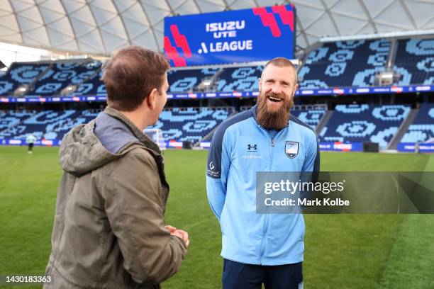 Sunrise weather presenter Sam Mac interviews Andrew Redmayne of Sydney FC during an A-Leagues Sunrise media opportunity at Allianz Stadium on October...