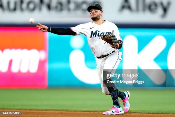 Miguel Rojas of the Miami Marlins throws to first base during the eighth inning against the Atlanta Braves at loanDepot park on October 03, 2022 in...