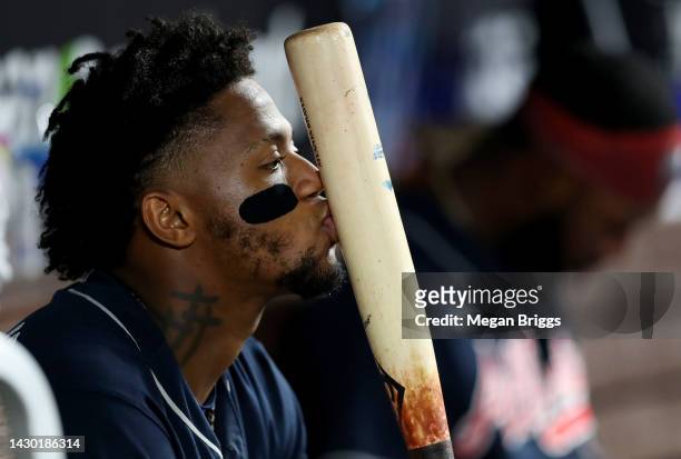 Ronald Acuna Jr. #13 of the Atlanta Braves kisses his bat during the fifth inning of the game against the Miami Marlins at loanDepot park on October...