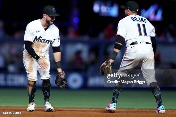 Jon Berti and Miguel Rojas of the Miami Marlins celebrate after defeating the Atlanta Braves at loanDepot park on October 03, 2022 in Miami, Florida.