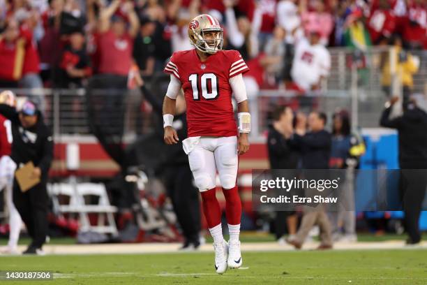 Quarterback Jimmy Garoppolo of the San Francisco 49ers celebrates after wide receiver Deebo Samuel rushed for a touchdown against the Los Angeles...