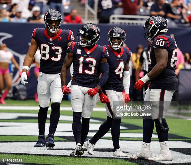 Brandin Cooks of the Houston Texans celebrates a touchdown with O.J. Howard, Phillip Dorsett and A.J. Cann against the Los Angeles Chargers at NRG...