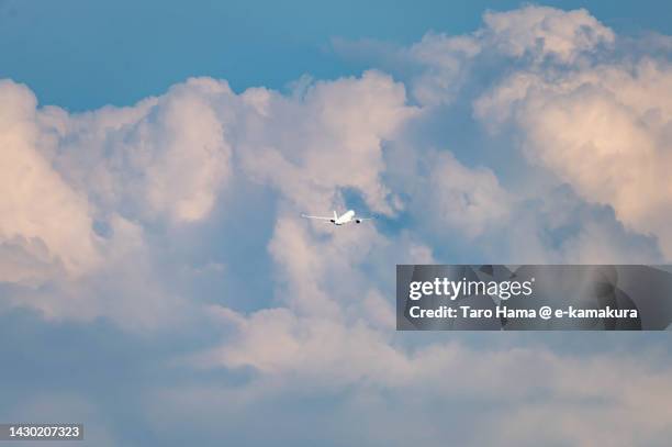 the airplane flying in the summer sky over tokyo of japan - beauty launch stock pictures, royalty-free photos & images