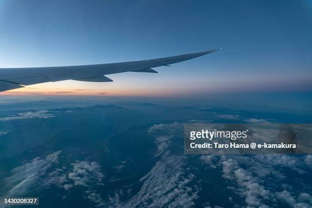 the airplane flying over mt. fuji in shizuoka of japan aerial view from airplane - tokai region stock-fotos und bilder
