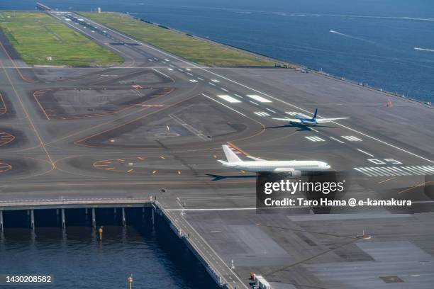 tokyo haneda international airport in tokyo of japan aerial view from airplane - tokyo international airport bildbanksfoton och bilder