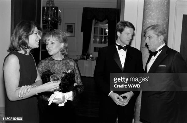 Barbara Walters and John Warner attend a party at the British embassy in Washington, D.C., on November 5, 1998.