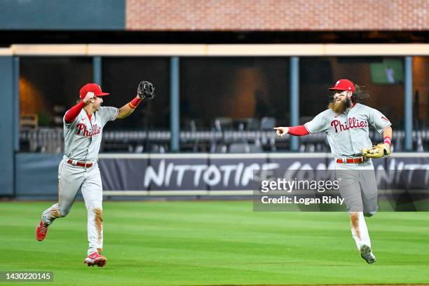 Brandon Marsh and Bryson Stott of the Philadelphia Phillies celebrate after the final out to clinch the Wild Card, their first playoff berth since...
