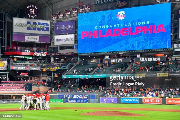 The Philadelphia Phillies celebrate after clinching the Wild Card, their first playoff berth since 2011 with a 3-0 win over the Houston Astros at...