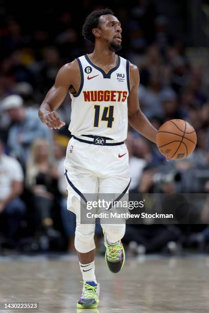 Ish Smith of the Denver Nuggets brings the ball down the court against the Oklahoma City Thunder in the fourth period during a pre-season game at...