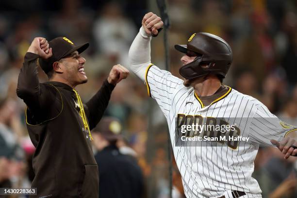 Manny Machado congratulates Wil Myers of the San Diego Padres after his three-run homerun during the eighth inning of a game against the San...