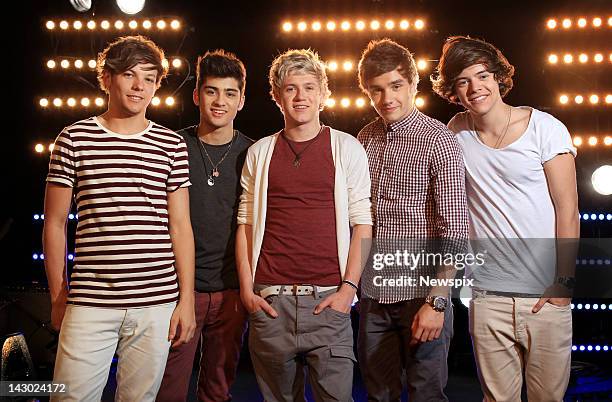 Singers Louis Tomlinson, Zayn Malik, Niall Horan, Liam Payne and Harry Styles of British boy band 'One Direction' pose during a portrait shoot at Fox...