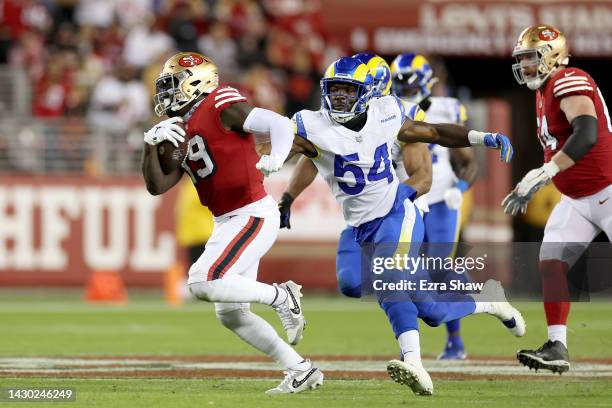 Wide receiver Deebo Samuel of the San Francisco 49ers rushes past linebacker Leonard Floyd of the Los Angeles Rams during the fourth quarter at...