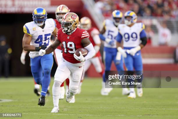 Wide receiver Deebo Samuel of the San Francisco 49ers rushes for a touchdown against the Los Angeles Rams during the second quarter at Levi's Stadium...