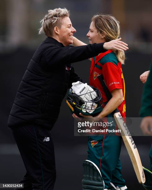 Elyse Villani of the Tigers and Nicola Carey of the Tigers hug after winning the WNCL match between Victoria and Tasmania at CitiPower Centre, on...
