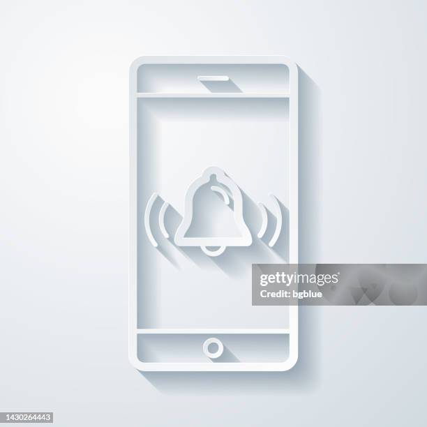 smartphone with ringing bell - notification. icon with paper cut effect on blank background - 3d ring shape stock illustrations