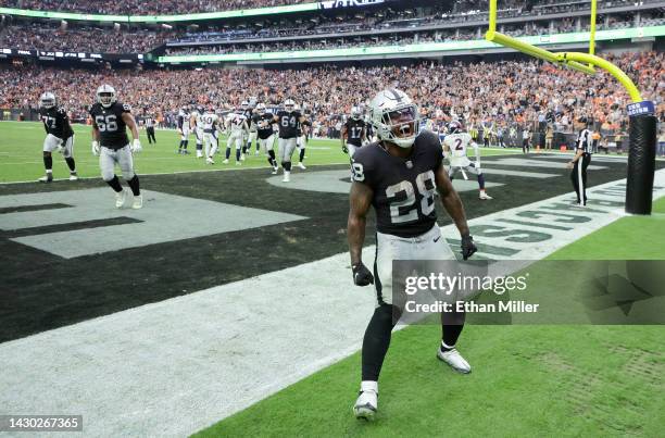 Running back Josh Jacobs of the Las Vegas Raiders celebrates his 7-yard touchdown run against the Denver Broncos in the fourth quarter of their game...