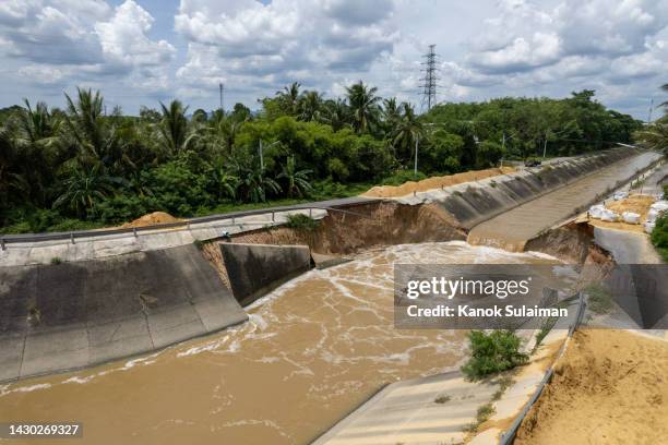 asphalt road collapsed and cracks in the roadside, road landslide view from aerial - earthquake warning stock pictures, royalty-free photos & images