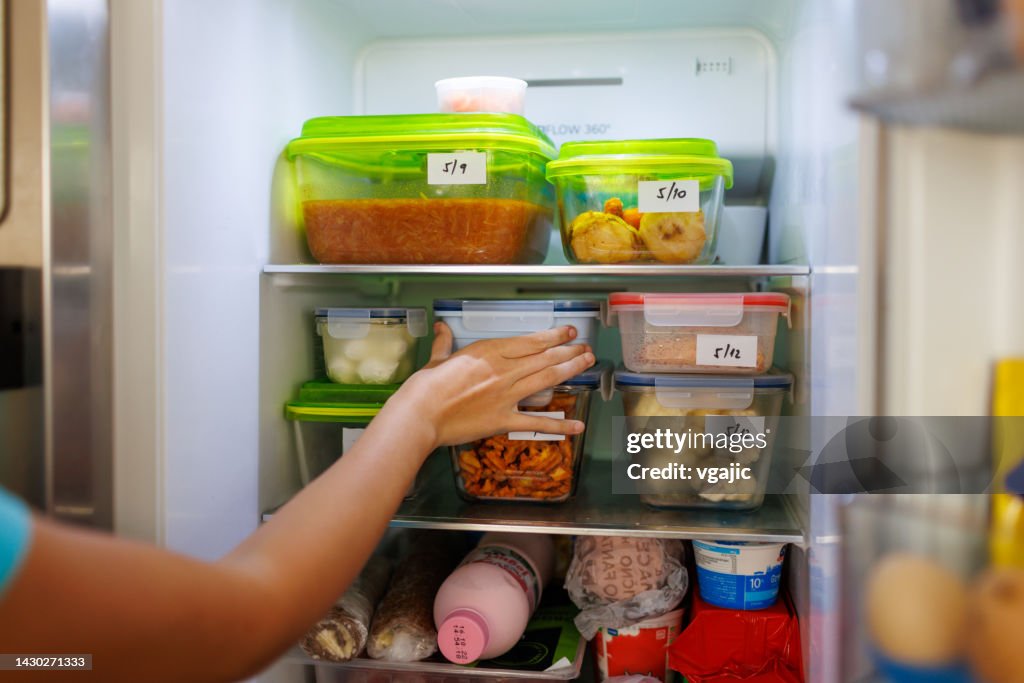 Food Leftovers Packaged In Boxes Inside A Home Fridge