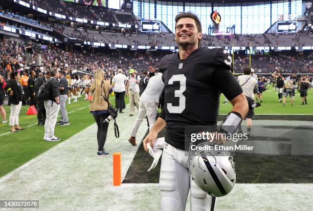 Quarterback Jarrett Stidham of the Las Vegas Raiders runs off the field after the Raiders' 32-23 victory over the Denver Broncos at Allegiant Stadium...