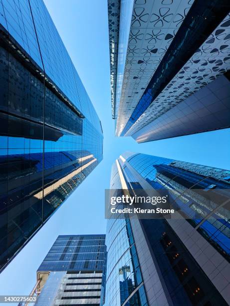 looking up in brisbane, australia towards a clear sky - office building australia stock-fotos und bilder